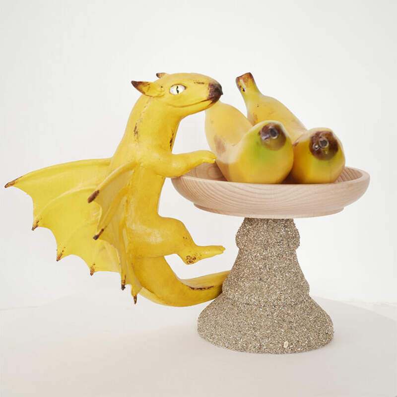 dragon companion sculpture balance ef25 eurofurence furry art banana fruit Of course I forgot totake pictures of the stand process. Here he is finished and trying to stealthily steal some bananas!