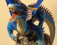 Dragon on a rockface sculpture commission artwork companion dragon treasure rock mountain
